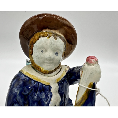 1020 - Aesthetic Movement Majolica Manx novelty tea pot, modelled as a three legged sailor, seated on a coi... 