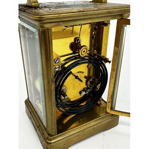 392 - Good quality French brass carriage clock, enamel dial, striking on a gong, 13.5cm high