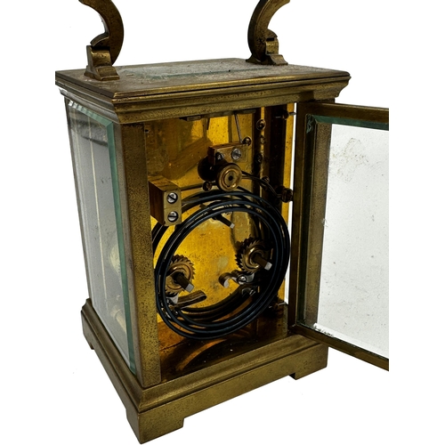 393 - Good quality French brass carriage clock, enamel dial, striking on a gong, 13.5cm high