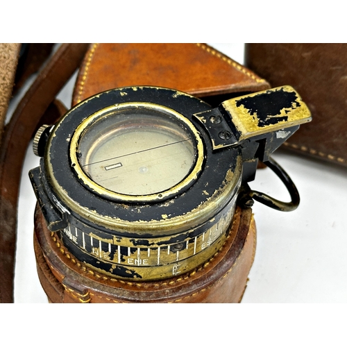 1129 - Mixed field lot to include 1942 military compass, two pairs of binoculars by Excelsior and Omega, an... 