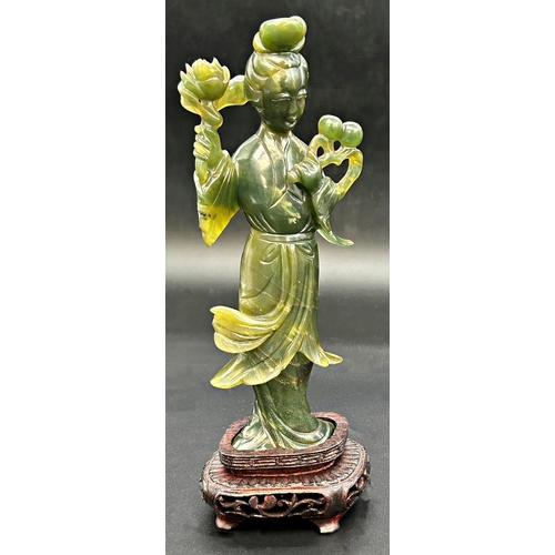 1049 - Chinese spinach jade Guan Yen, bespoke stand, 23cm high