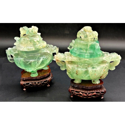 1051 - Pair of green jade lidded twin handled censors, upon bespoke plinth bases, 13cm high (2)