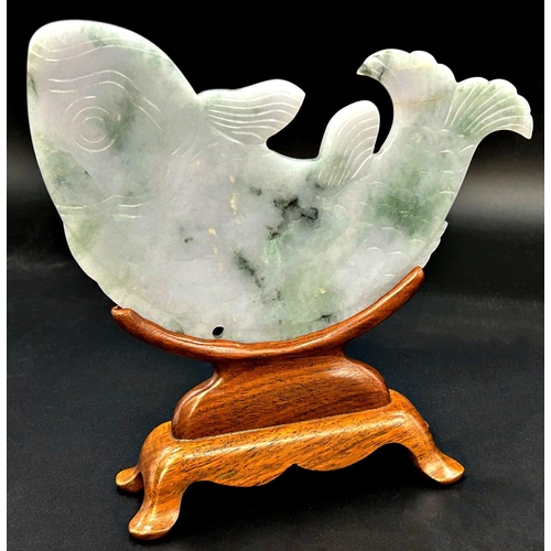 1052 - Chinese celadon jade fish, bespoke stand, 19cm high