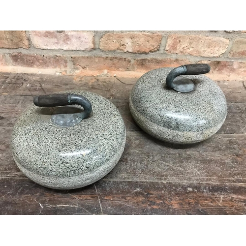 1111 - Good pair of polished granite curling stones with inset wooden handles, 28cm diameter