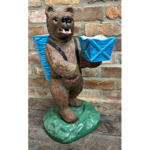 1007 - Majolica style pottery Blackforest fireside bear, holding two turquoise glazed vessels, open mouth w... 