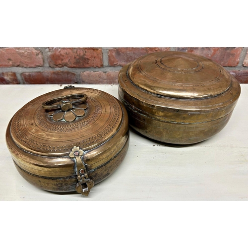 1061 - Indian teak and brass bound twin handled box, the hinged lid enclosing two candle boxes, 49cm long w... 