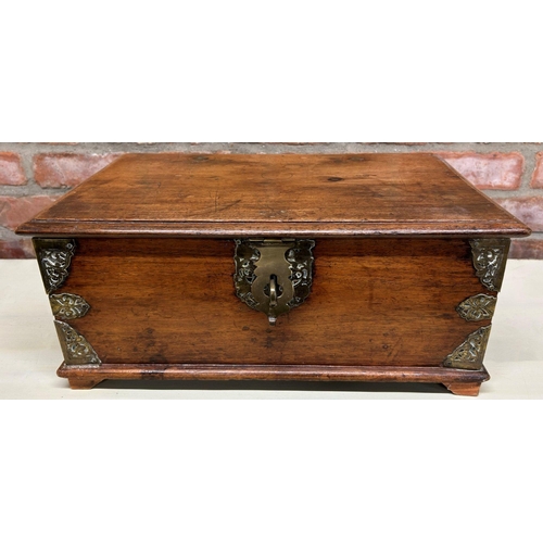 1061 - Indian teak and brass bound twin handled box, the hinged lid enclosing two candle boxes, 49cm long w... 