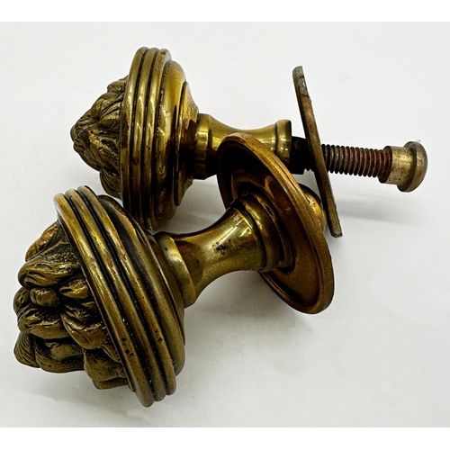 1178 - A pair of brass lion head door handles