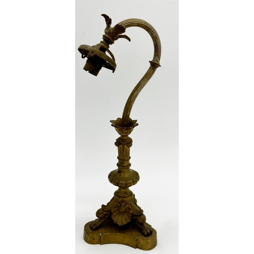 1215 - Art Nouveau gilt brass table lamp, with fluted arched stem on paw feet and triform base, 39cm high