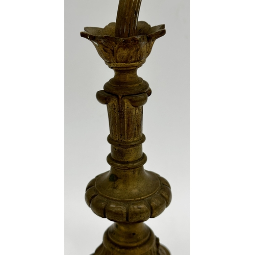 1215 - Art Nouveau gilt brass table lamp, with fluted arched stem on paw feet and triform base, 39cm high