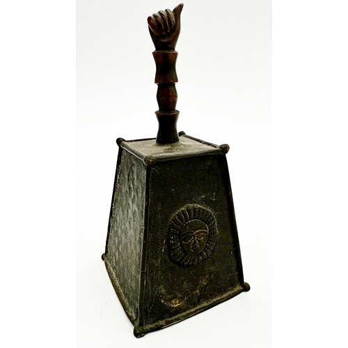 1063 - Interesting tribal bronze hand bell, the simulated handle with clenched fist knop, and engraved squa... 