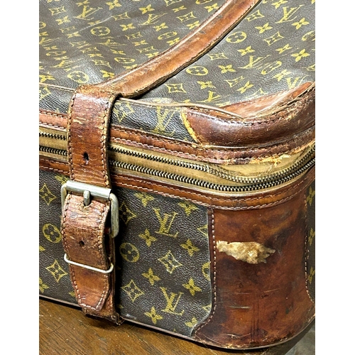 1950s Louis Vuitton suitcase, with leather strap work and canvas lined  aluminium frame, 70cm wide x