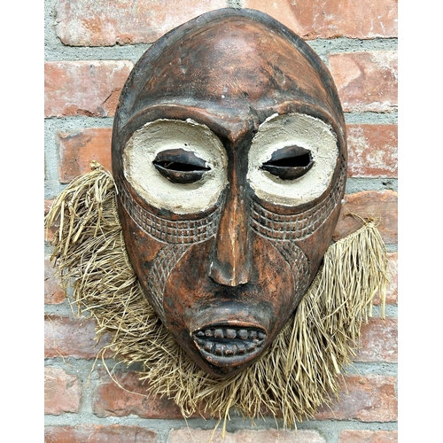 1042 - African tribal mask with clay eyes and straw beard, 53 x 43cm