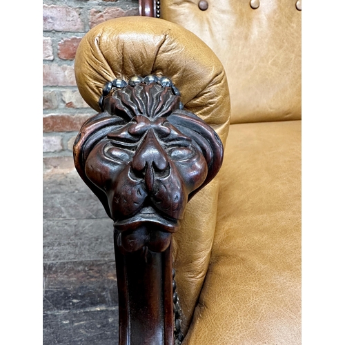 1479 - Exceptional quality late Regency mahogany framed library chair, with tan leather buttoned upholstery... 