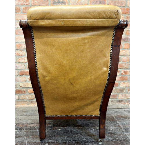 1479 - Exceptional quality late Regency mahogany framed library chair, with tan leather buttoned upholstery... 