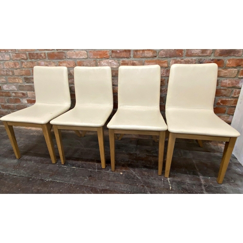 1296 - Set of four modernist cream leather dining chairs with stylised x-frames