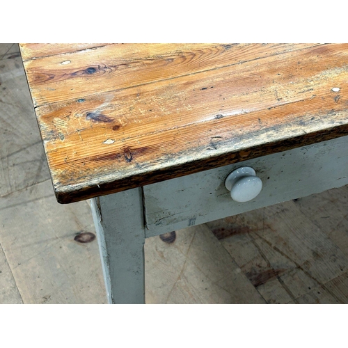 1410 - 19th century reclaimed pine refectory kitchen table, plank top on a painted base fitted with two dra... 