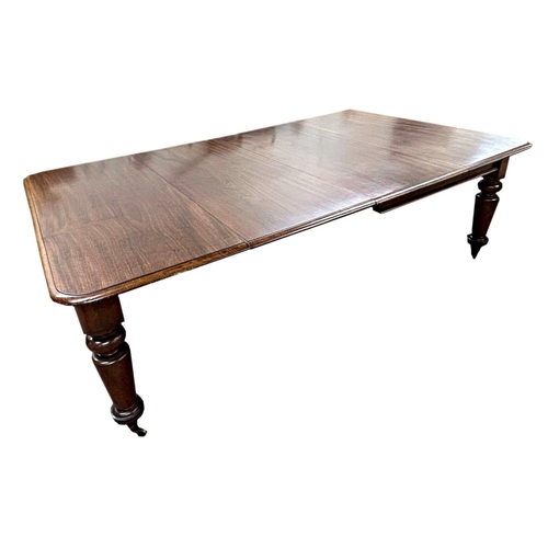 1413 - William IV mahogany extending dining table, fitted with an extra leaf, the moulded top on four turne... 