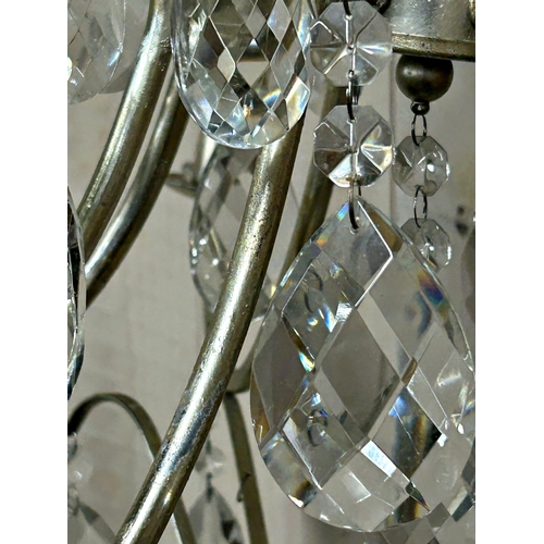 1211 - A contemporary pair of silvered metal crystal drop chandeliers with various glass prismatic drops, 5... 