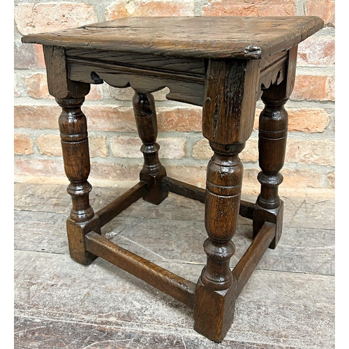 1440 - A Georgian oak joint stool with wavy apron on turned supports, 50cm high x 44cm wide