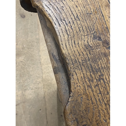 1406 - Georgian elm dough bin, the hinged top on a tapered base and four style legs, 69cm high x 143cm wide... 