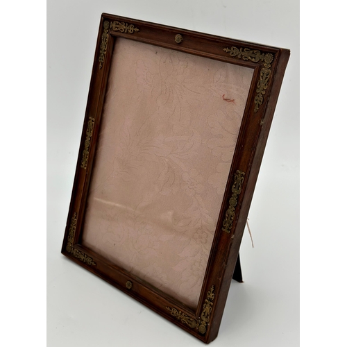 1156 - A continental gilt applied fruitwood easel frame, 26cm x 21cm