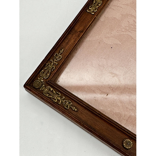 1156 - A continental gilt applied fruitwood easel frame, 26cm x 21cm