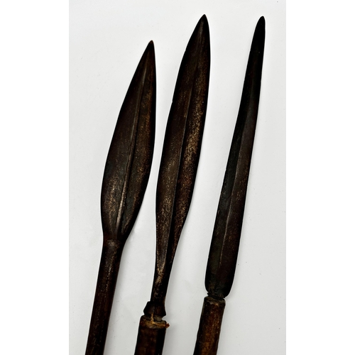 1079 - Tribal interest - three primitive made spears with wooden handle and metal spikes, the largest 160cm... 