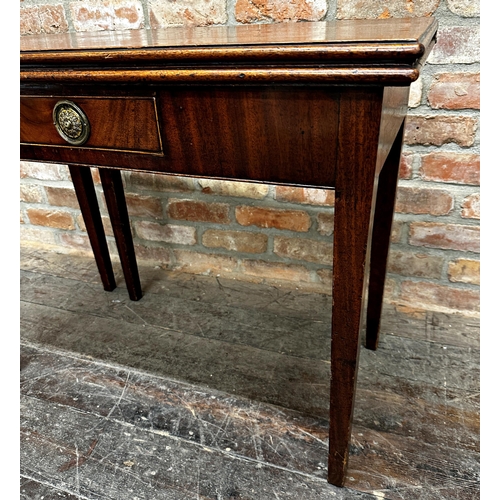 1471 - Georgian flame mahogany fold over tea table, fitted a single drawer upon square tapered legs, 74cm h... 