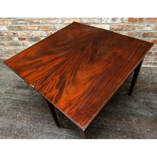 1471 - Georgian flame mahogany fold over tea table, fitted a single drawer upon square tapered legs, 74cm h... 