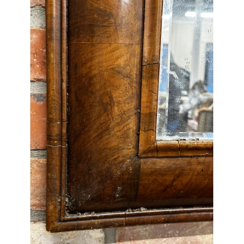 1290 - Georgian walnut cushion wall mirror, original bevelled glass, 98 x 70cm