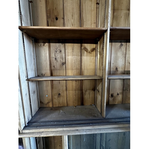 1489 - Good large 19th century pine shop display cabinet, with sliding glazed doors enclosing a shelved int... 