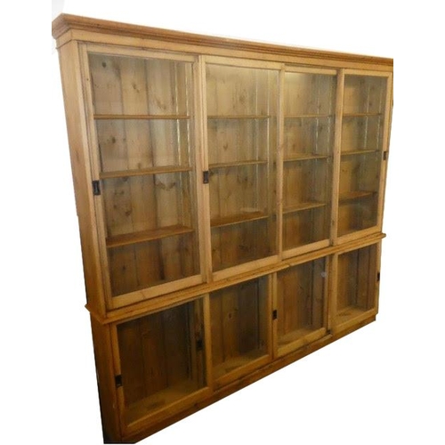 1489 - Good large 19th century pine shop display cabinet, with sliding glazed doors enclosing a shelved int... 