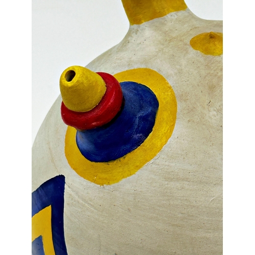 477 - Mid-century Inca style hand painted wine pot with indistinct makers stamp to the handle, 31cm high