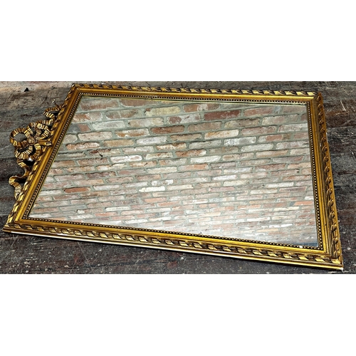 1149 - Antique giltwood and gesso wall mirror, with rope twist frame and ribbon pediment, 140 x 85cm