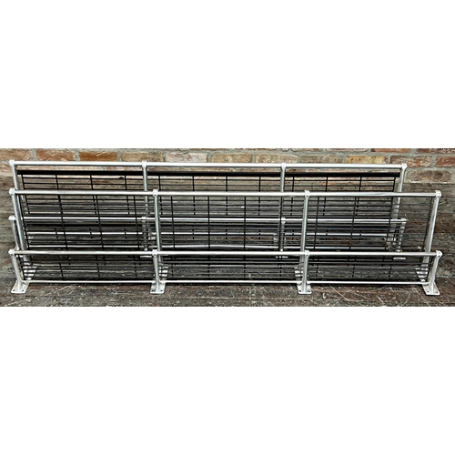 1169 - A matched pair of chrome and steel vintage railway carriage two tier luggage racks, 190cm long