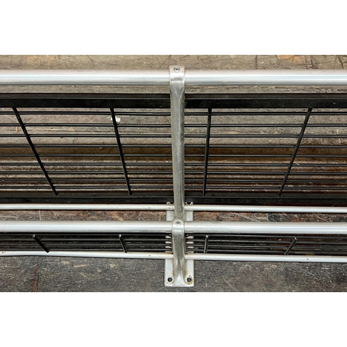 1169 - A matched pair of chrome and steel vintage railway carriage two tier luggage racks, 190cm long