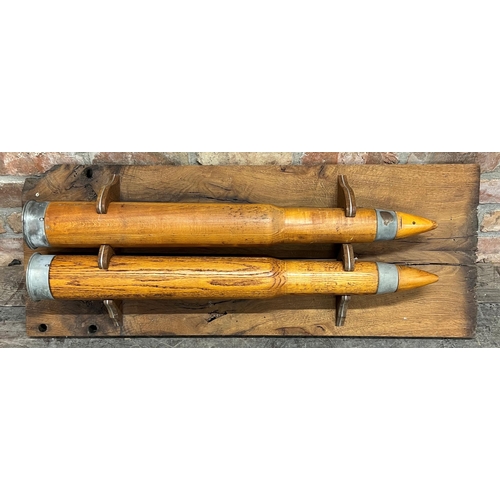 1173 - Pair of 1944 Naval Oak Dummy Cartridges for Training, mounted to a bespoke fruitwood plaque, 105 x 4... 