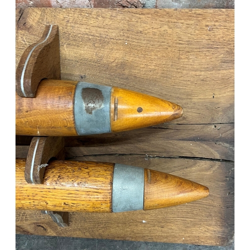 1173 - Pair of 1944 Naval Oak Dummy Cartridges for Training, mounted to a bespoke fruitwood plaque, 105 x 4... 