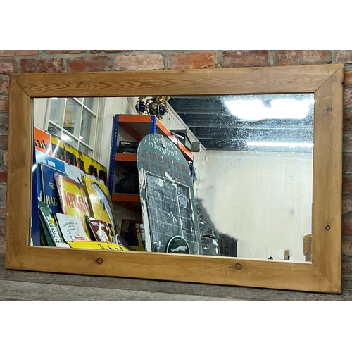 1143 - Large pine framed wall mirror, 152 x 92cm