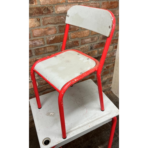 1176 - Pair of French Bauhaus child's school desks and chairs, with colourful tubular steel frames, the des... 