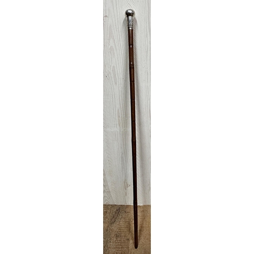 175 - A late 19th/early 20th century, silver knopped bamboo swagger stick, marks rubbed, of tapering form,... 