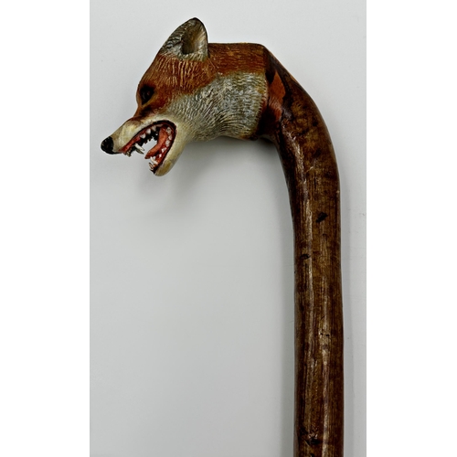 185 - Exceptional quality hand carved walking stick, with fox head knop, open mouth with teeth and glass e... 