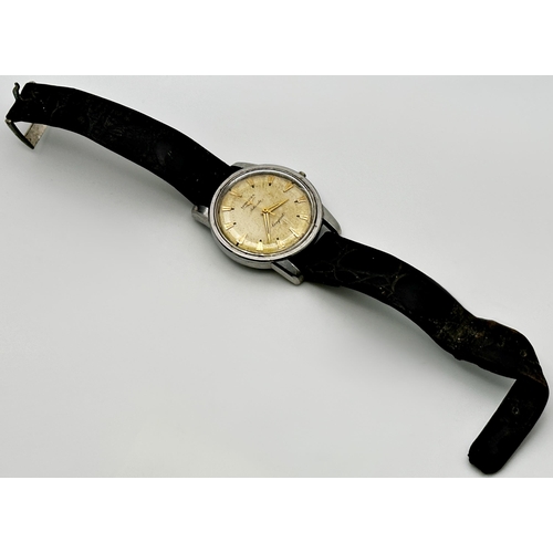 355 - A Gent's Longines Conquest automatic wristwatch, c.1950s/60s, the dial with gilt baton markers and t... 