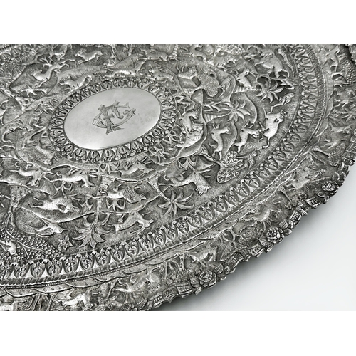 306 - Good Indian white metal twin handled tray, profusely embossed with an animal procession, to include ... 