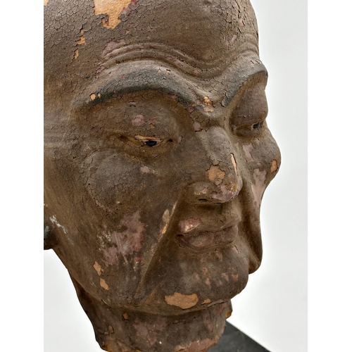 501 - Chinese terracotta head sculpture of a gentleman, upon an ebonised stand, 49cm high