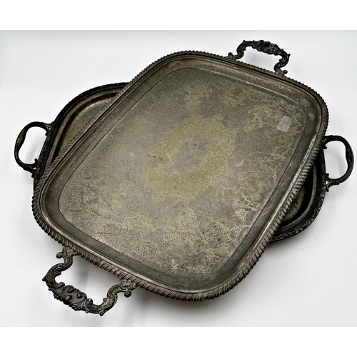 258 - Two similar antique cast Sheffield plate twin handled trays, the largest 65cm long