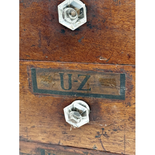 551 - Set of eight 19th century apothecary drawers, with original labels and glass knobs, 13cm high x 25cm... 