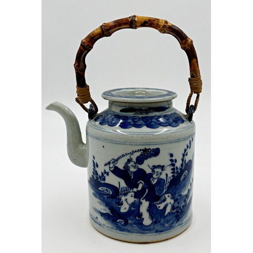 503 - Kangxi style Chinese blue and white porcelain teapot, decorated with figures and with bamboo handle,... 