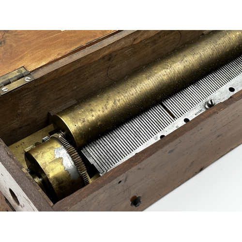 379 - Early walnut cased music box by Ami Rivenc, playing six airs, 40cm long